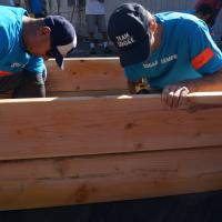 SDG&E employees putting together a raised garden bed